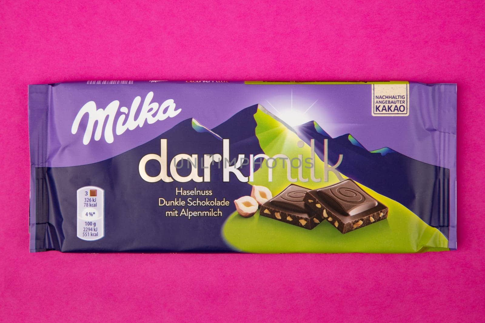 WETZLAR GERMANY - 2022-04-11: Milka chocolate bar on purple background. Milka milk chocolate bar. Milka is a brand of chocolate confection which originated in Switzerland in 1901.