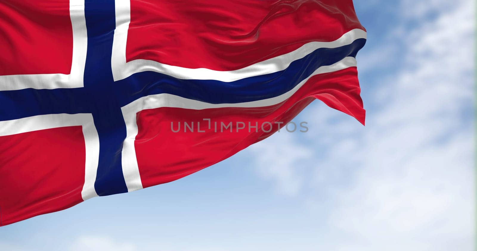 Close up view of the Norway national flag waving in the wind. The Kingdom of Norway is a Nordic country in Northern Europe. Fabric textured background. Selective focus. 3D illustration