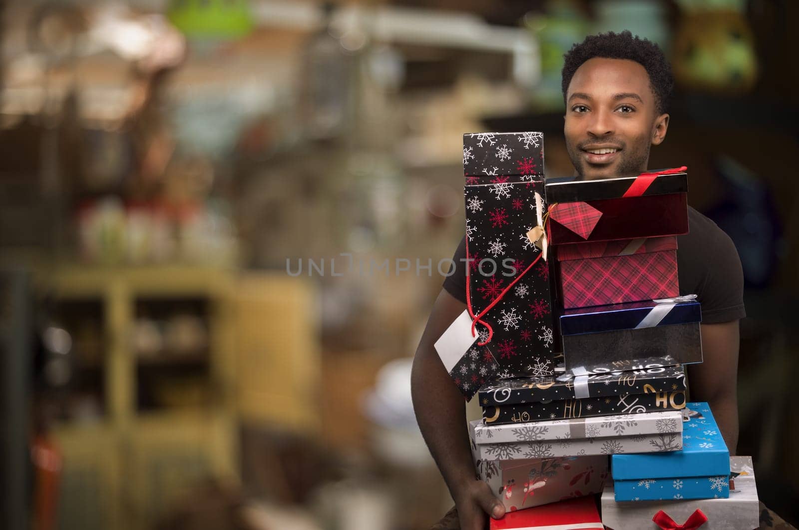 man giving gifts for christmas holding package stack holiday surprises december shopping at retail store