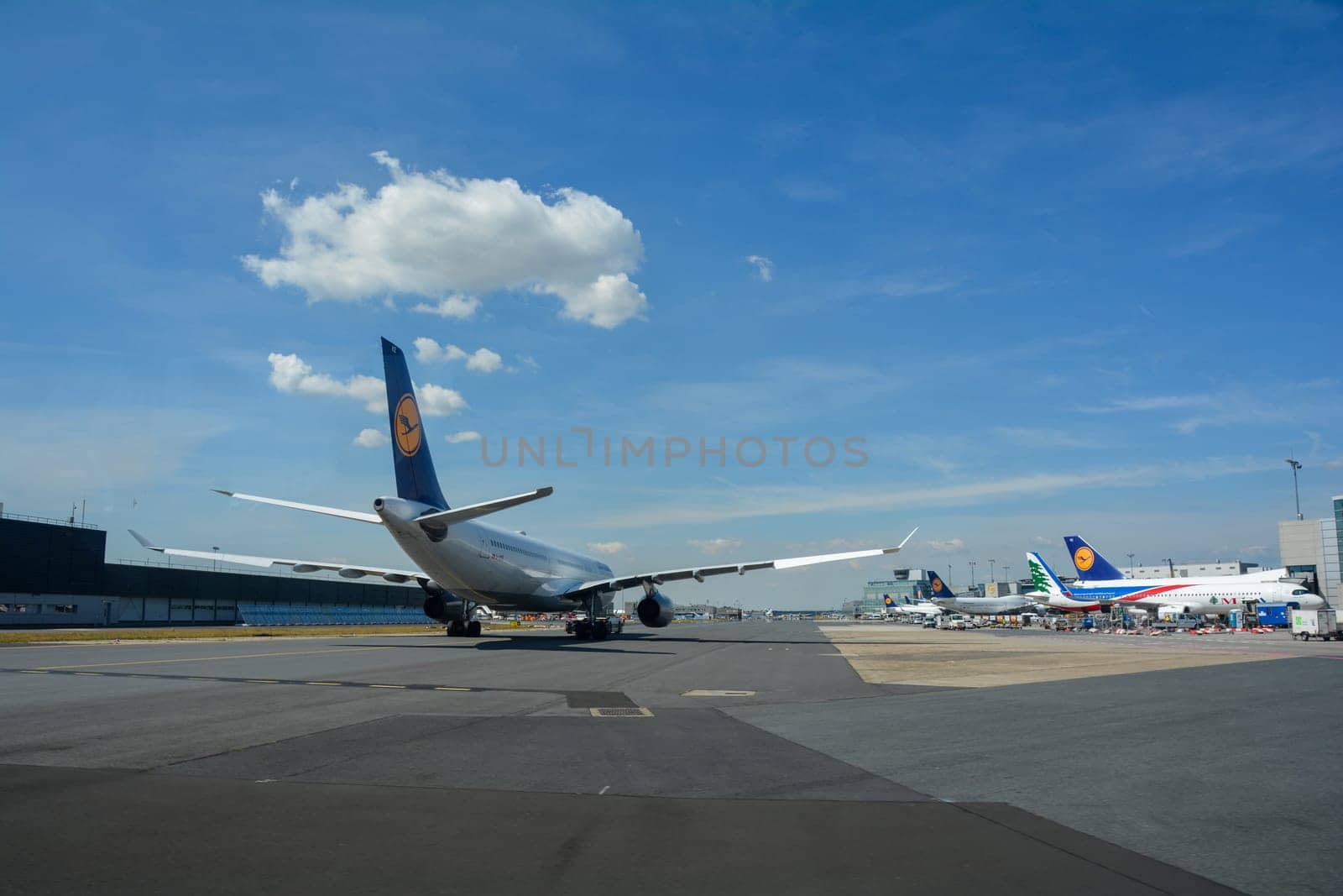 Frankfurt Airport Germany August 02, 2022 - Lufthansa machines at the terminal and on the runway