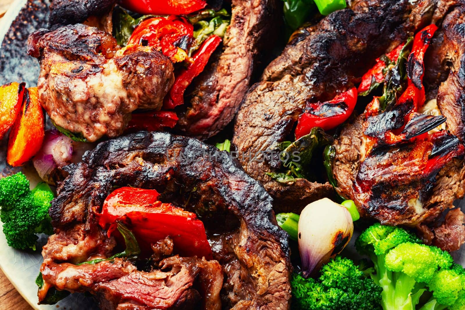 Deep fried meat with vegetable garnish. Roasted meat and vegetables. Copy space