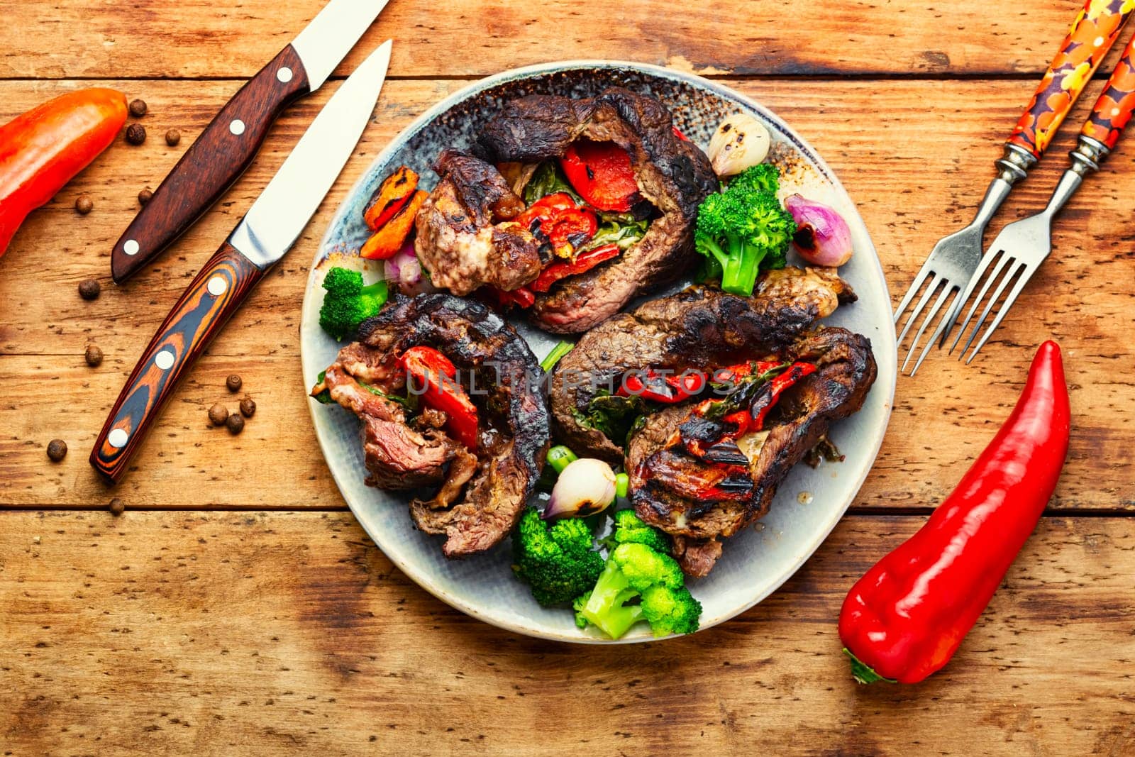 Deep fried meat with vegetable garnish. Roasted meat and vegetables. Copy space