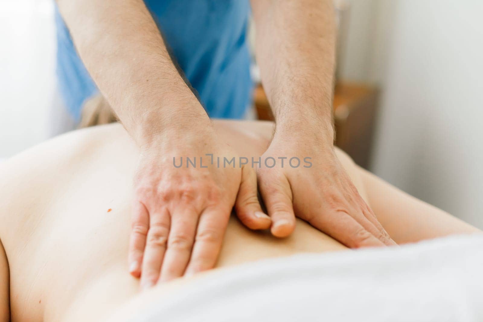 Anti-cellulite foot massage for fat woman. Concept of personal care, weight loss, diet. Close-up.