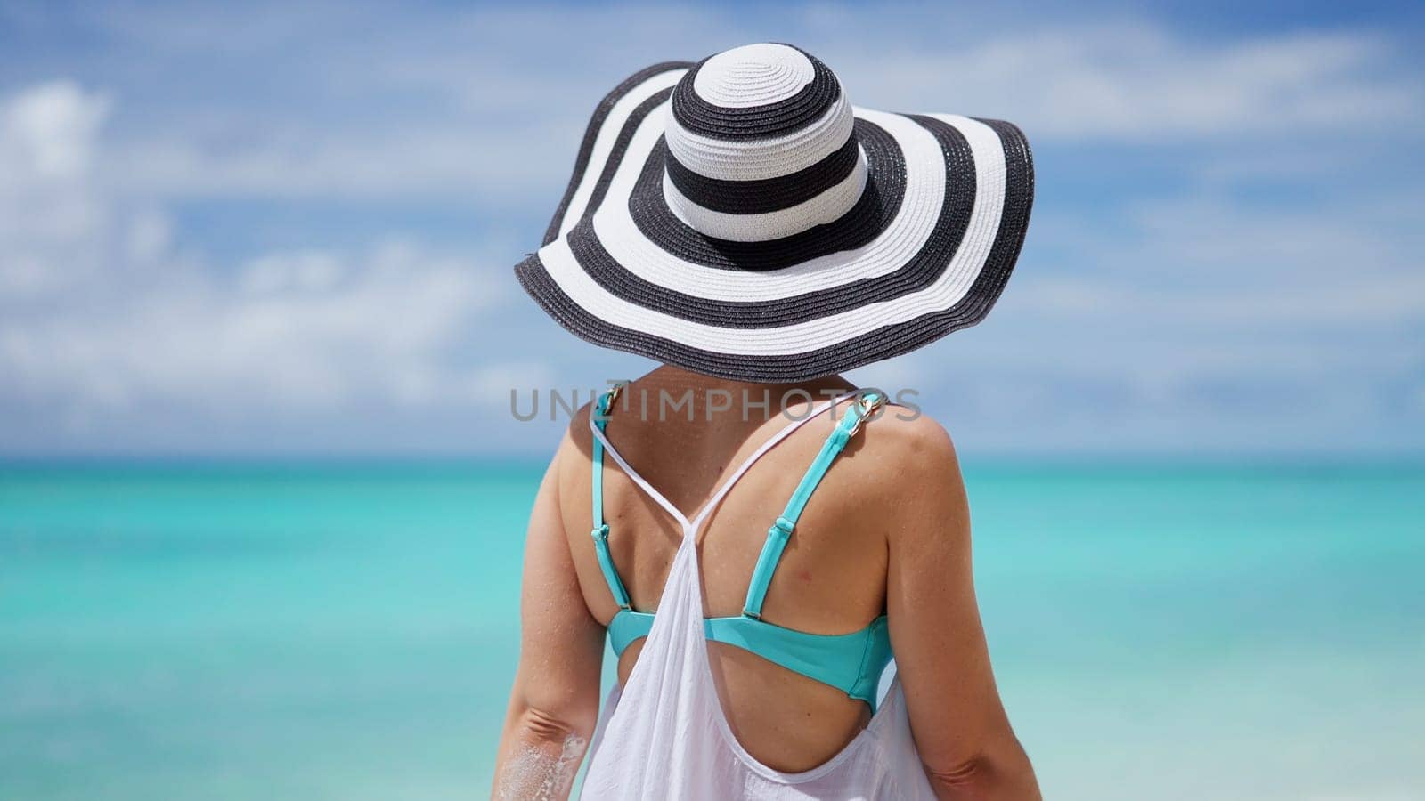 Beach Lifestyle And Ocean Water. Young Girl On Summer Vacation