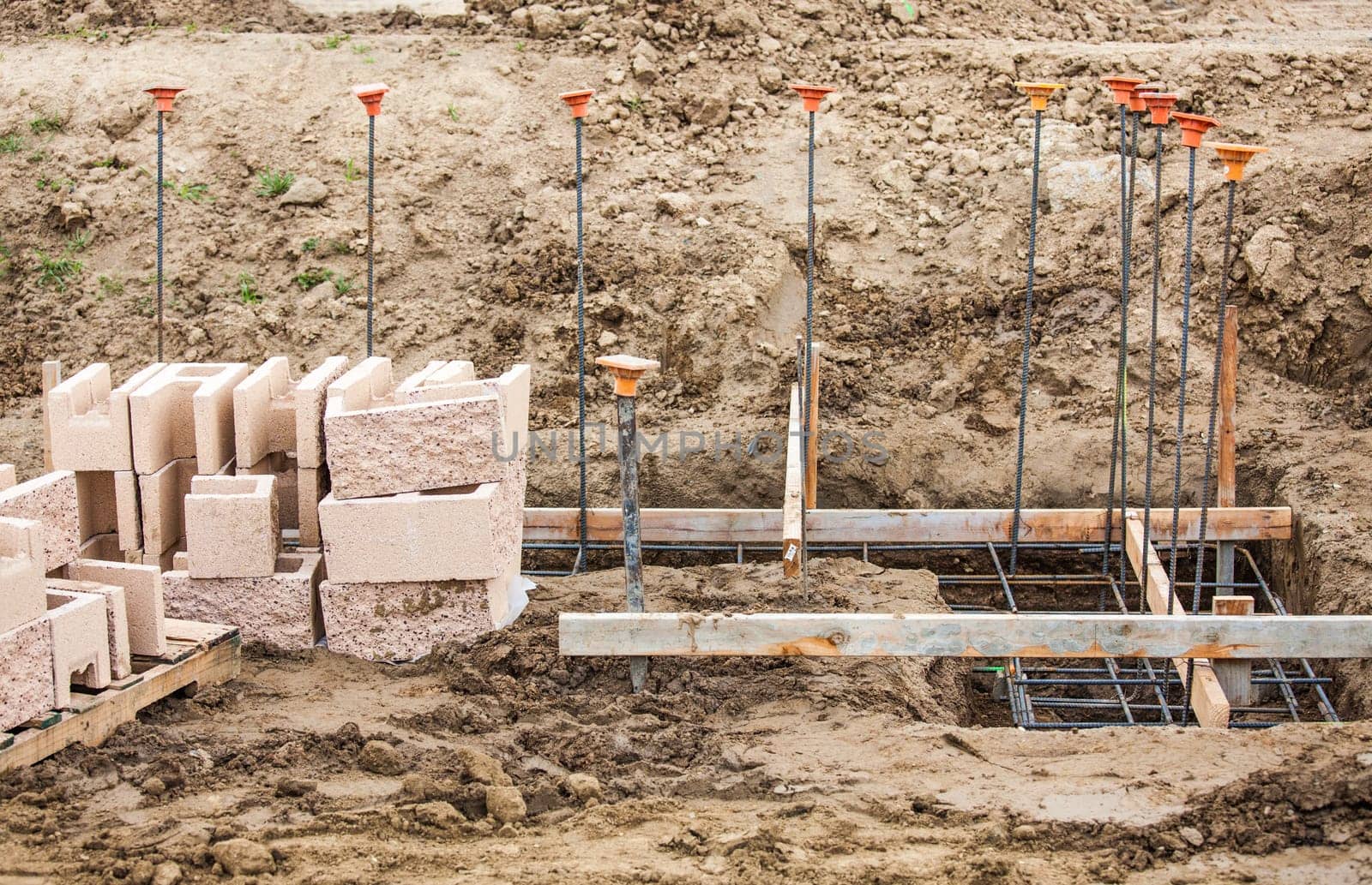 Details of a Construction Site with Concrete Blocks and Rebar.