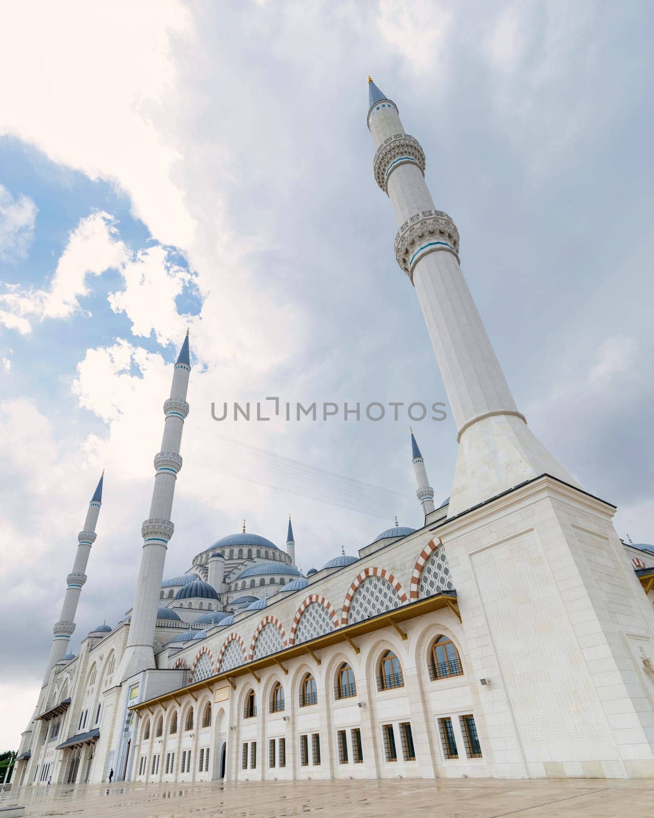 Low angle side shot of Grand Camlia Mosque, or Buyuk Camlica Camii, a modern complex for Islamic worship, built in 2019, located in Camlica hill in Uskudar district, Istanbul, Turkey, in a summer day