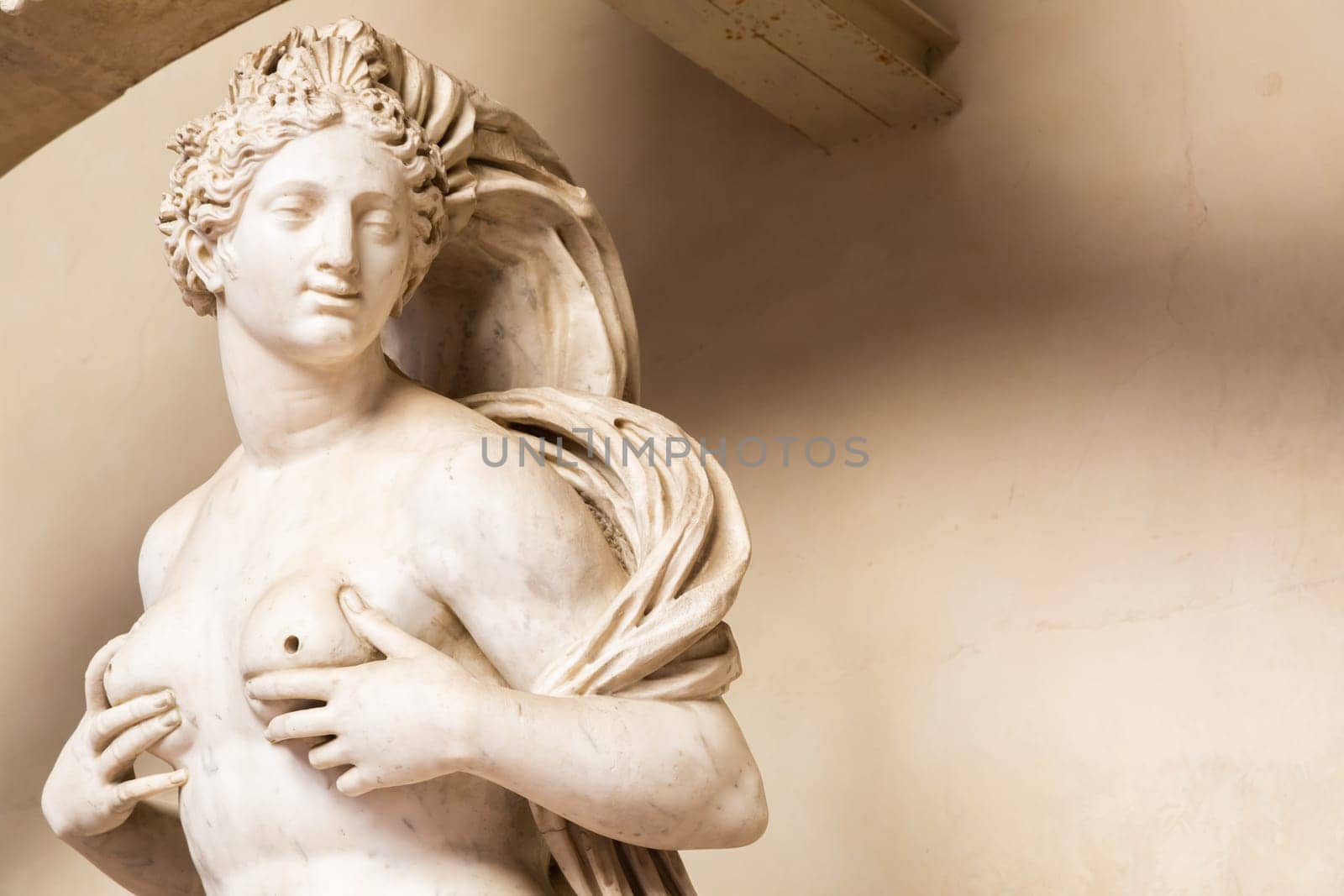 Florence, Italy - circa July 2021. Sensual naked woman statue. Beauty figure made of stone.