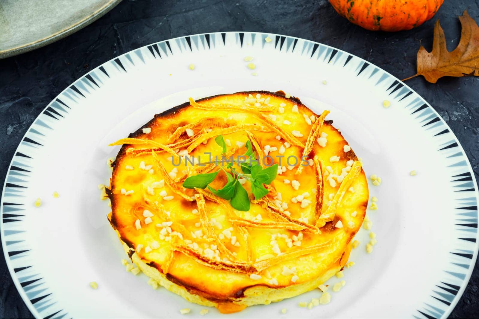 Baked casserole with pumpkin and cottage cheese.