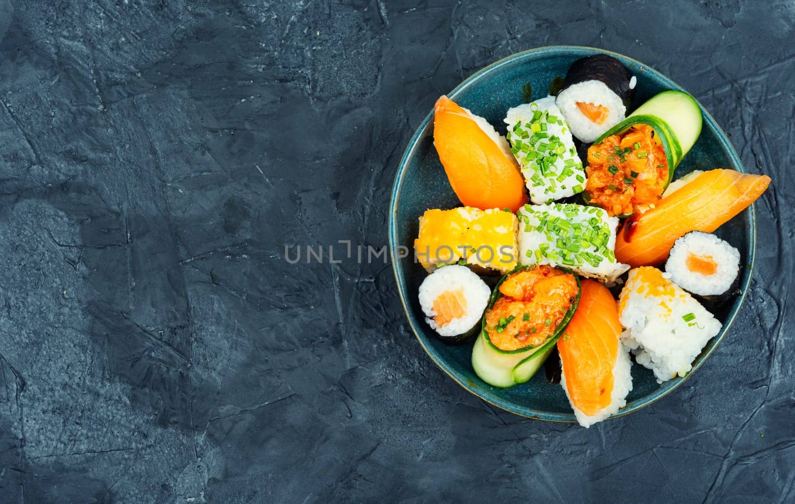 Traditional sushi rolls on the plate. Sushi menu. Japanese food. Space for text