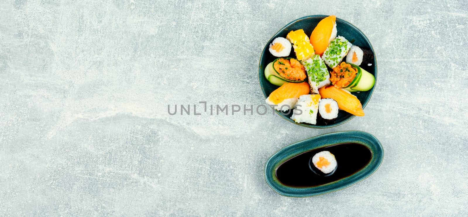 Traditional sushi rolls on the plate. Sushi menu. Japanese food. Space for text