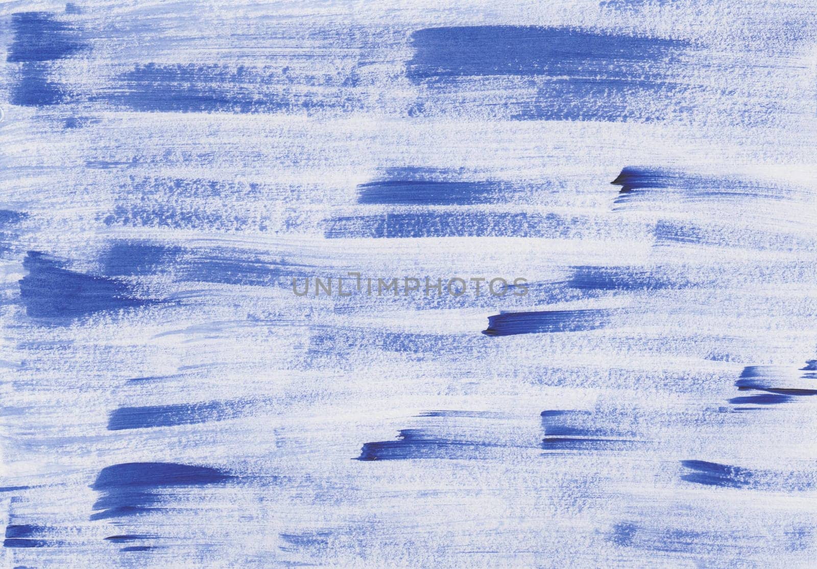 Uneven brush strokes with acrylic paint in blue