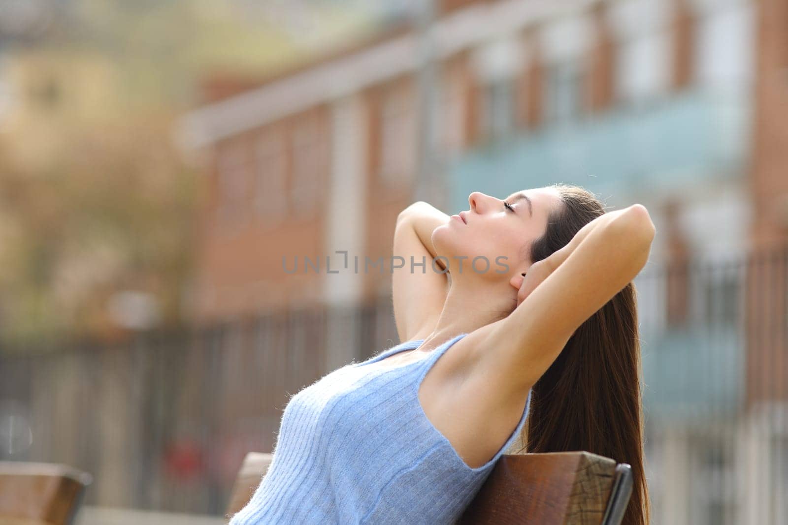 Profile of a teen relaxing in a bench