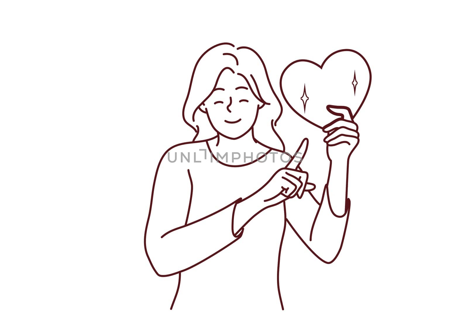 Happy woman point at heart in hands