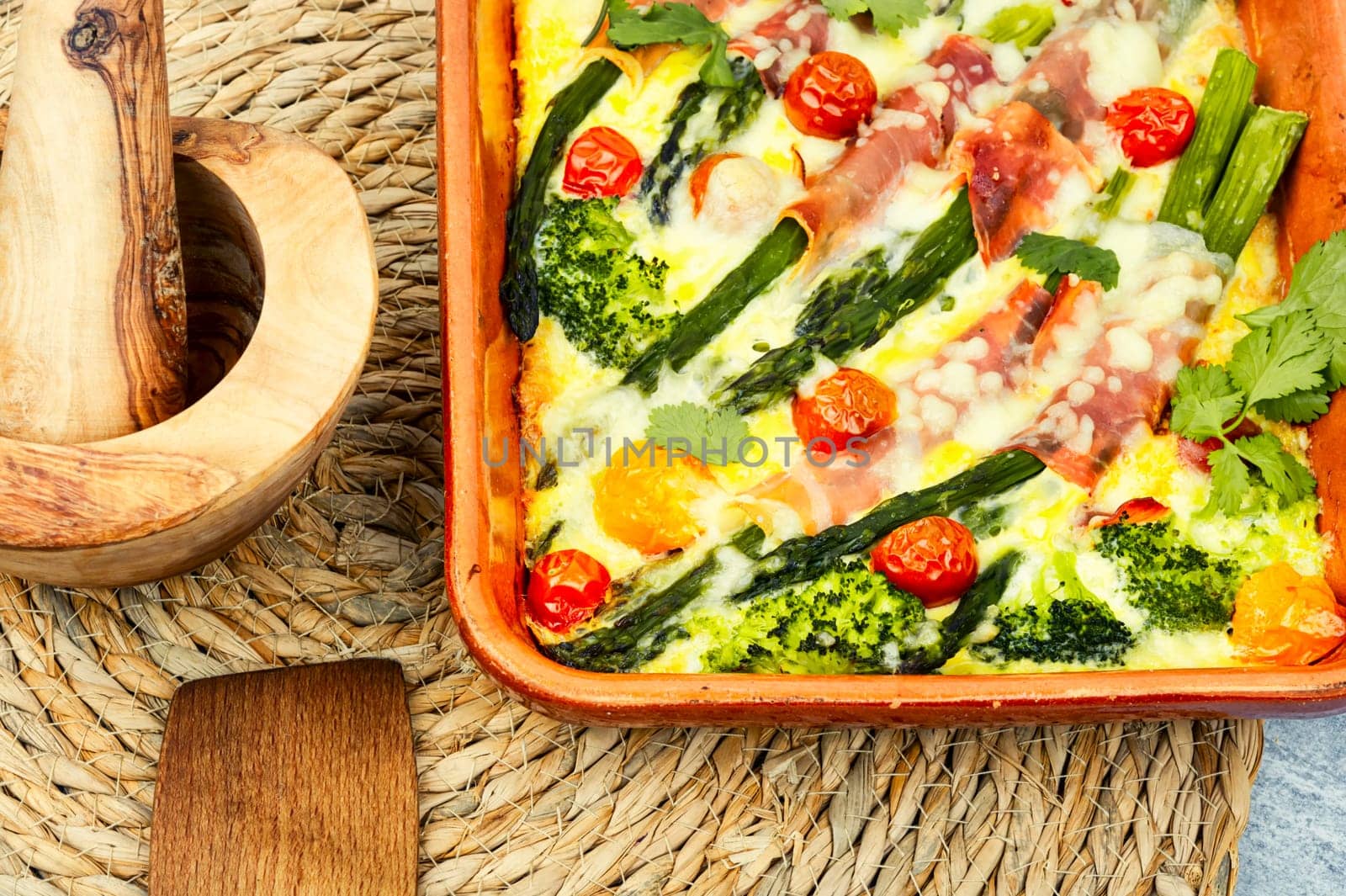 Asparagus wrapped in bacon with grated parmesan cheese.Food background