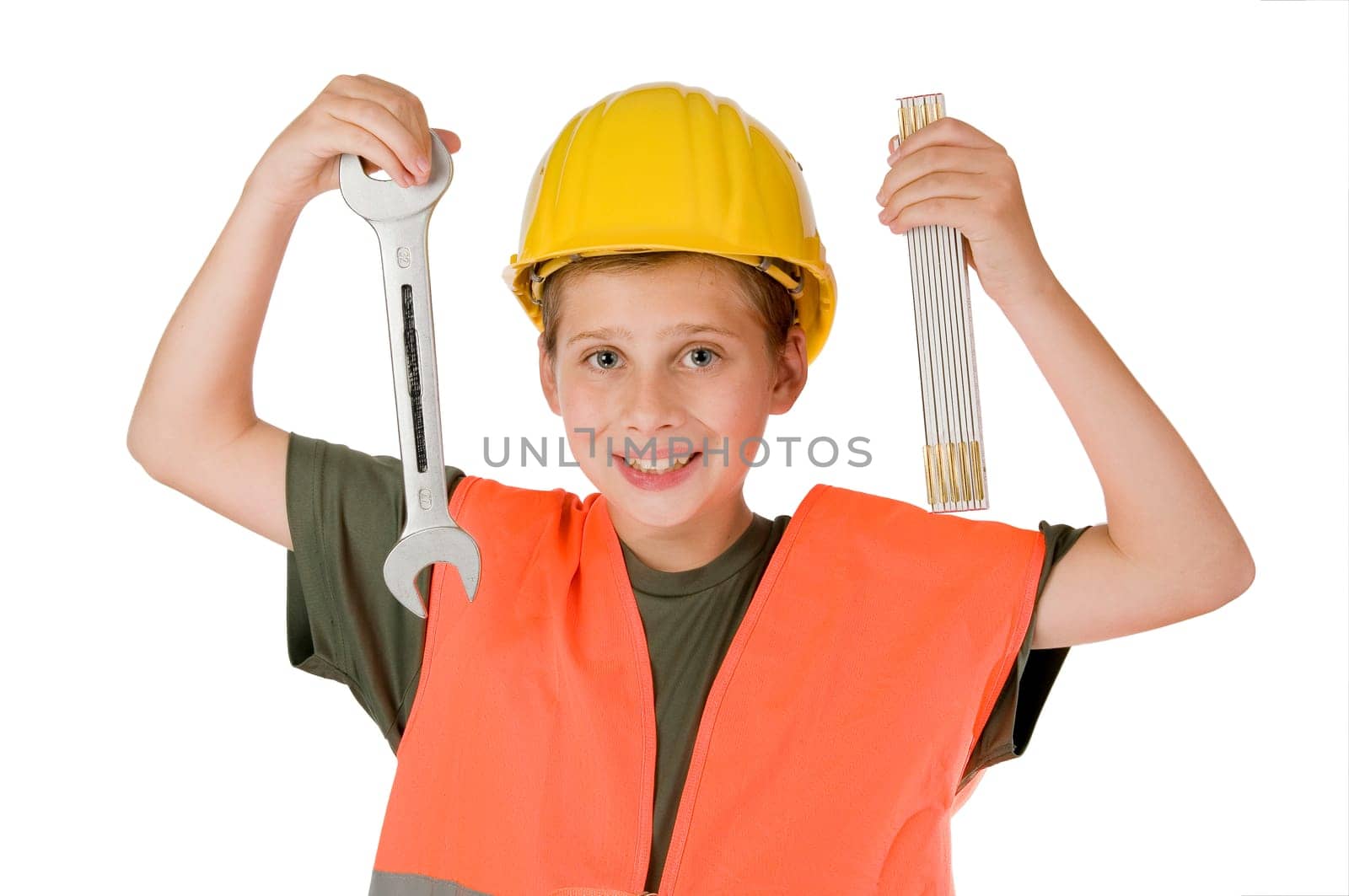 Frontal torso view of a 13-year-old male teenager wearing a yellow construction site helmet and orange warning vest against a white background showing a inch stick (limb band size) and a fork key into the camera