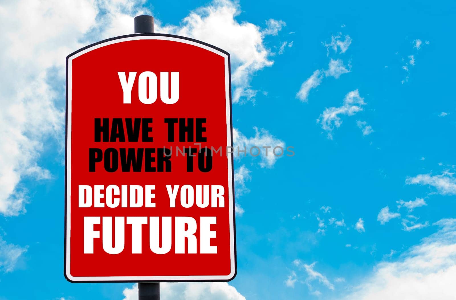 You Have The Power To Decide Your Future motivational quote written on red road sign isolated over clear blue sky background. Concept  image with available copy space