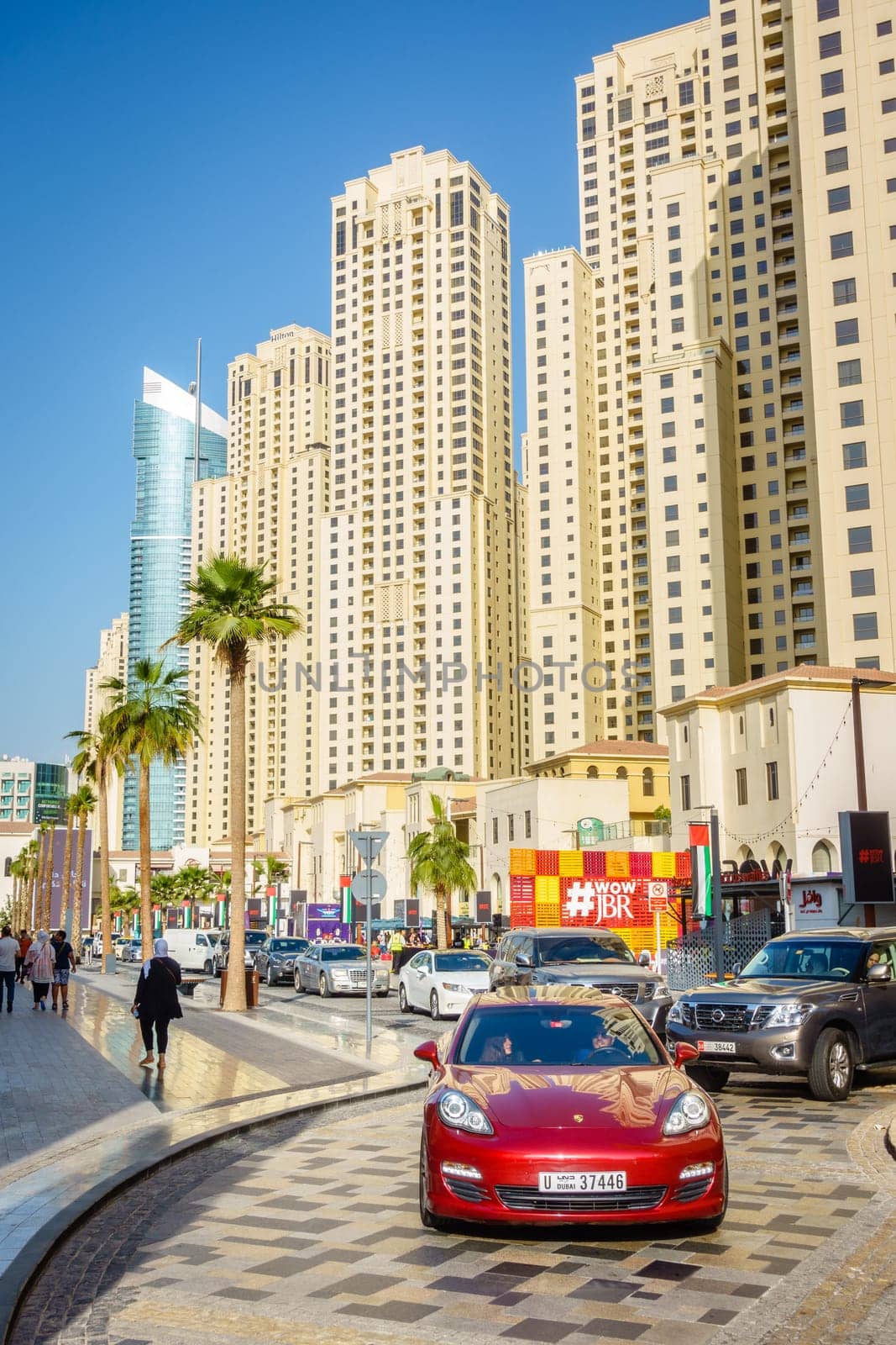 Dubai, UAE, February 23, 2018: Always busy Jumeirah Beach Residence (JBR) drive - a popular shopping, dining and entertainment destination