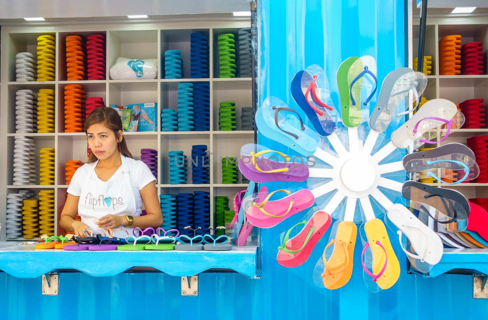 Dubai, UAE, February 23, 2018: Beach flip flop shop at the Jumeirah Beach Residence (JBR) Walk - a polular destination for food, shopping and entertainment