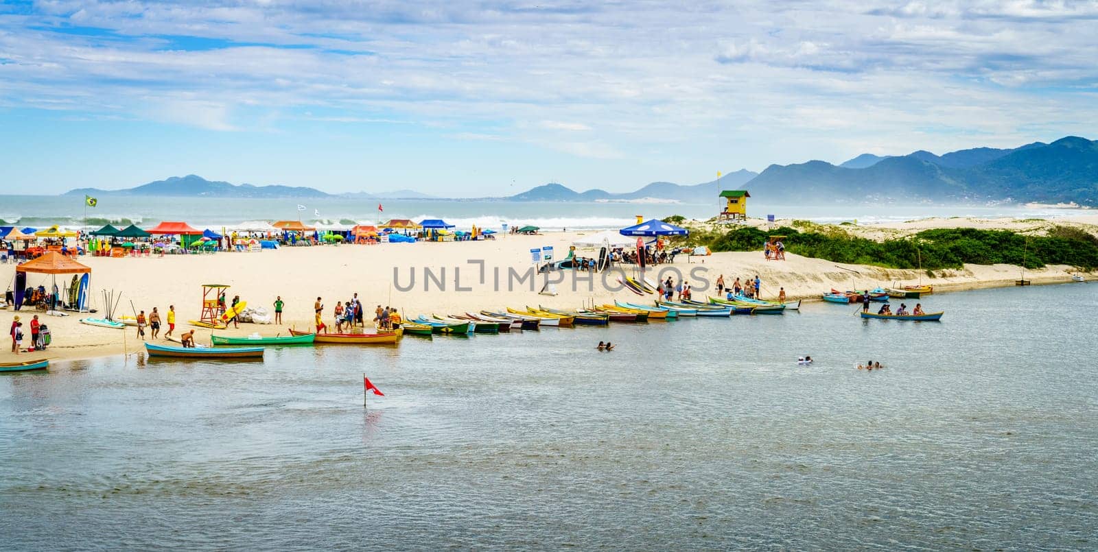 Guarda do Embau, January 14, 2022: Rio da Madre separating Praia Guarda do Embau beach from the mainland