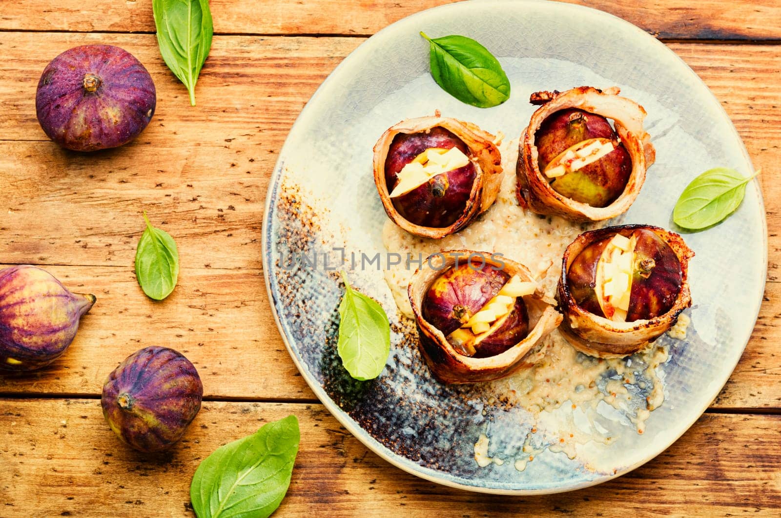 Baked figs with cheese and bacon. Festive autumn snack.