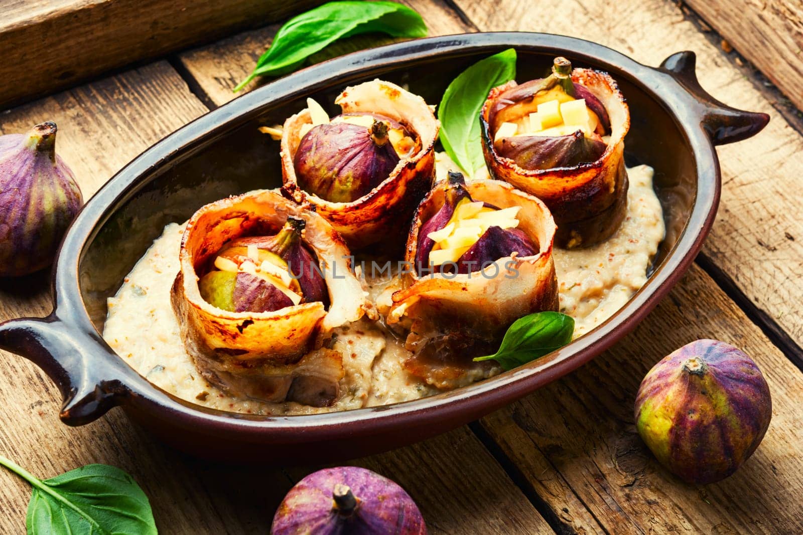 Baked figs with cheese and bacon. Festive autumn snack.