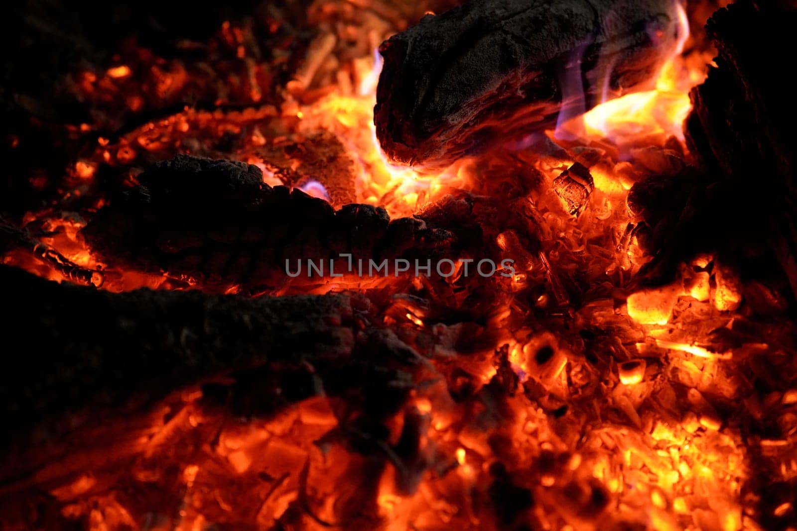 Fire and embers at the campfire