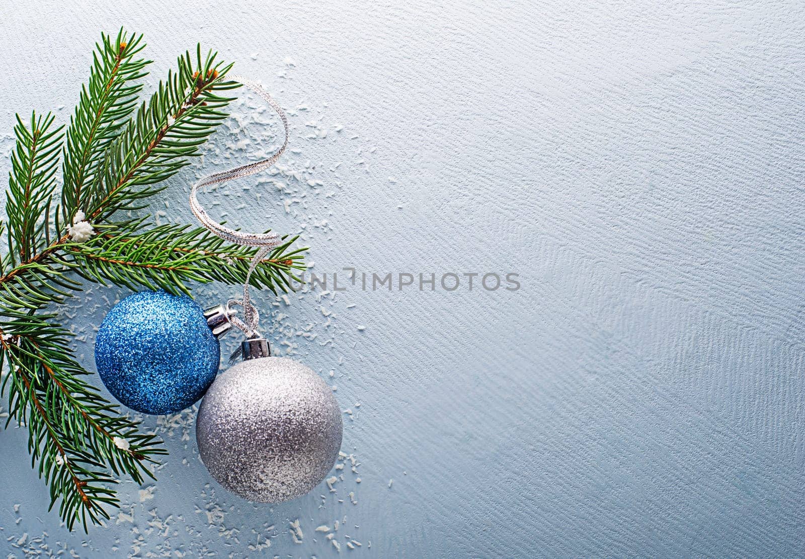 Christmas blue winter background with fir tree and decor. Top view with copy space