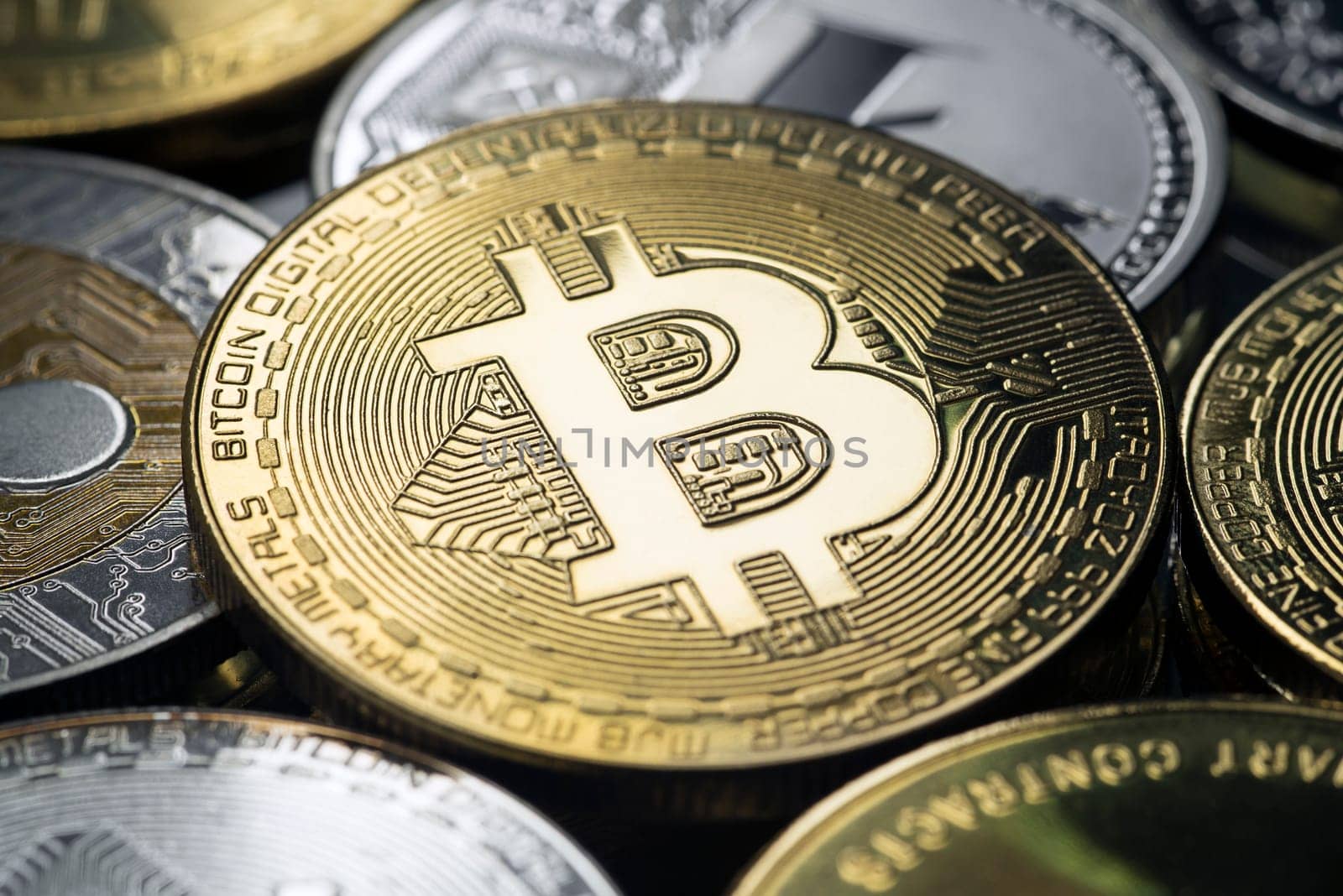 Bitcoin and alt coins close up shoot. Cryptocurrency concept