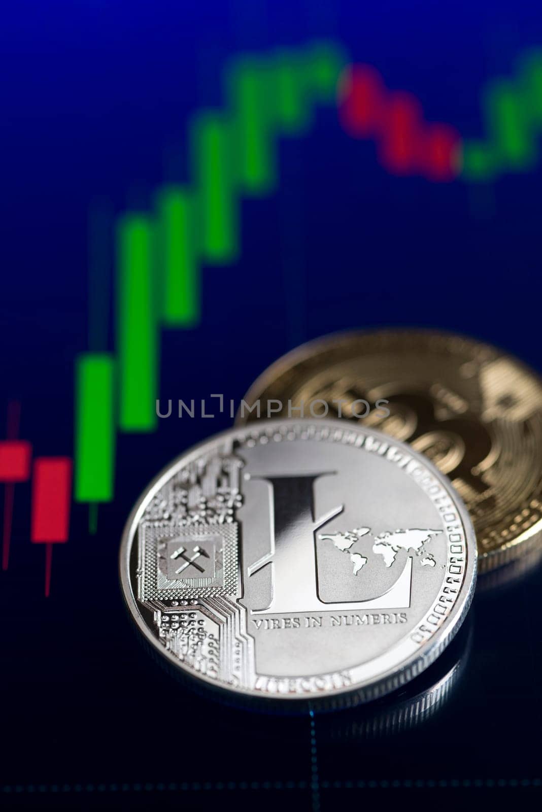 Bitcoin and Litecoin cryptocurrency investing concept. Trading on the cryptocurrency exchange. Trends in bitcoin and litecoin exchange rates. Rise and fall charts.