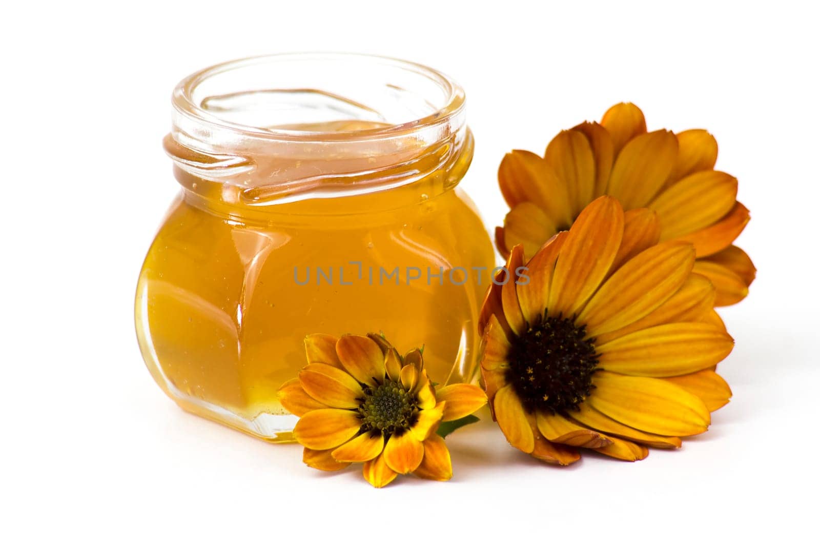 honey and flowers on white  background
