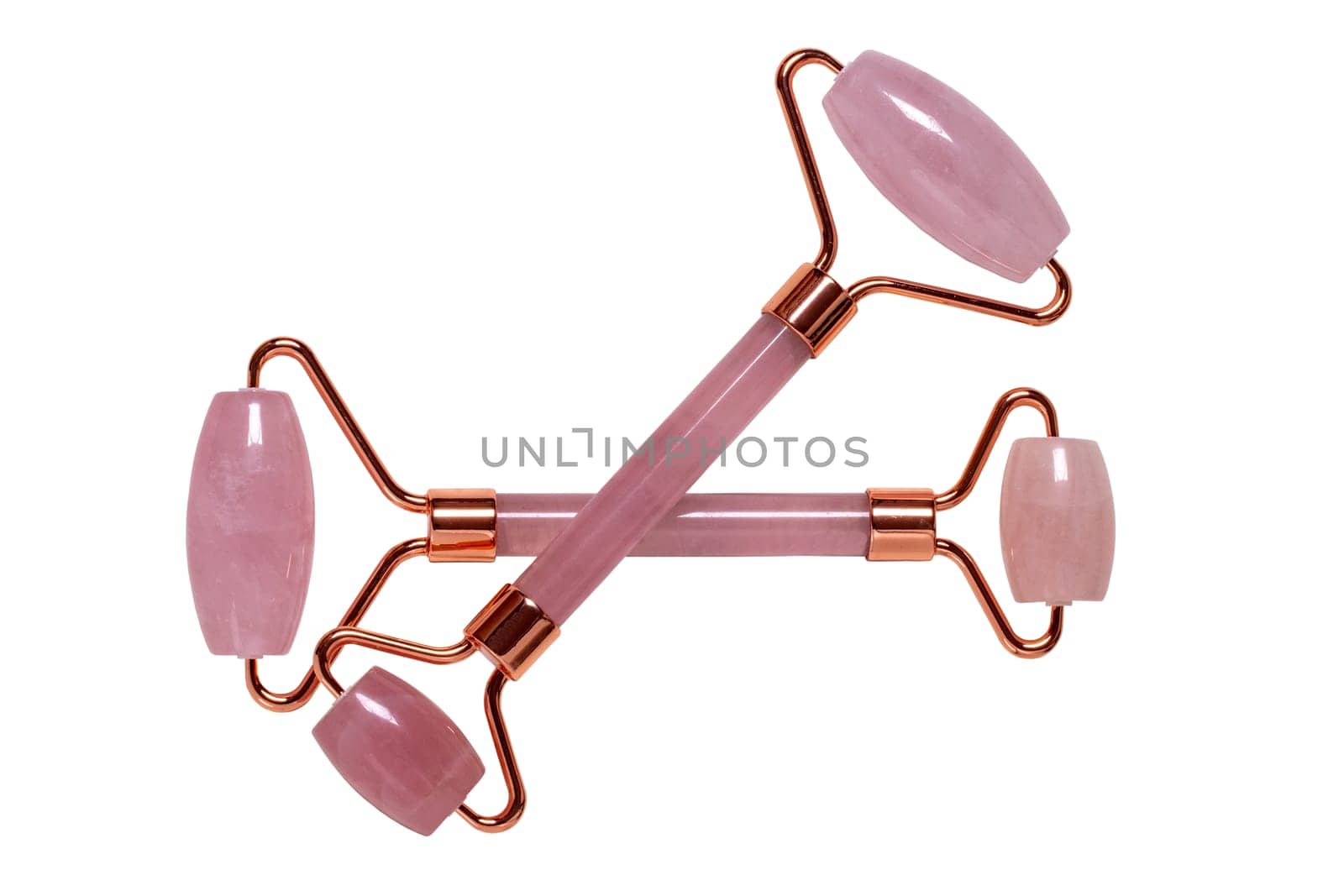 Gua Sha massage tools. Close-up of two pink jade facial roller or beauty roller for better blood circulation and muscle activation. Clipping path. Beauty concept. Isolated on white.