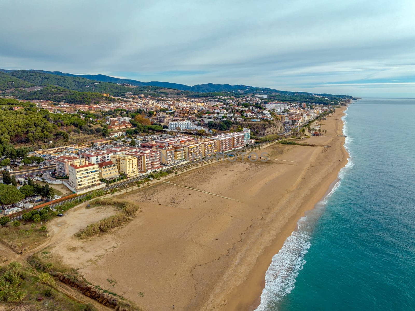 Aerial panoramic view of Canet de Mar city at dawn. Located in El Maresme, Barcelona, Spain