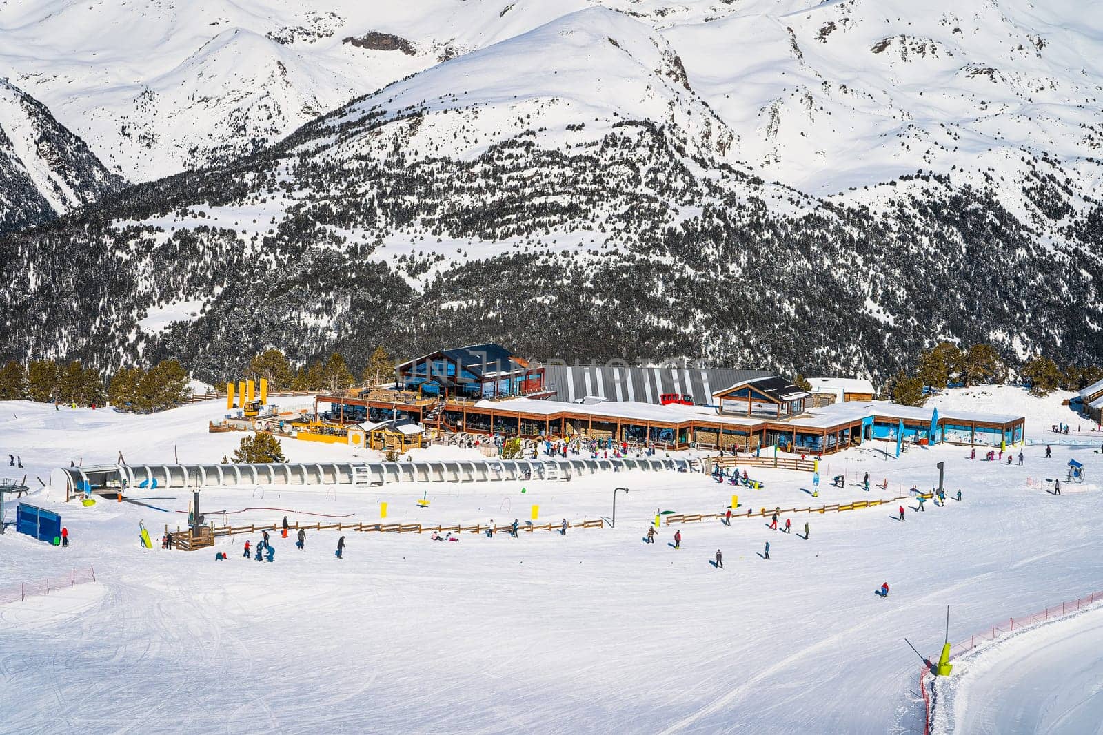 Winter sports and family ski holiday, view on Soldeu ski lifts cross centre with snowy mountains in background, Grandvalira, Andorra, Pyrenees