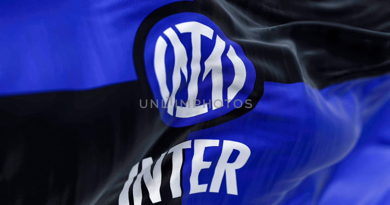 Milan, Italy, July 2022: The flag of Inter Football Club waving in the wind. Inter is a professional football club based in Milan, Italy