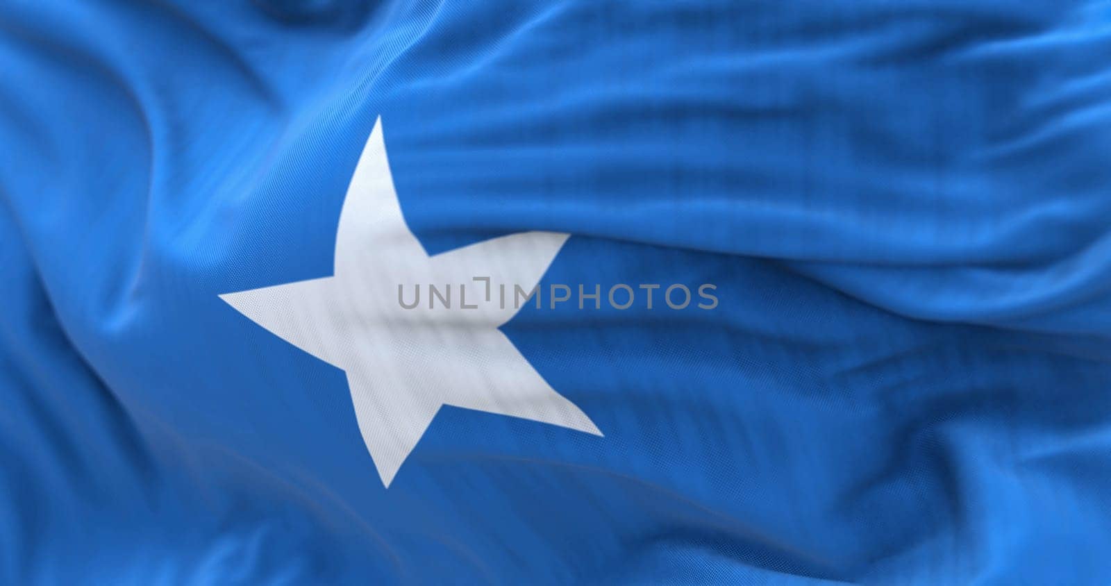 Close-up view of the Somalia national flag waving in the wind. Federal Republic of Somalia is a country in the Horn of Africa. Fabric textured background. Selective focus. 3d illustration