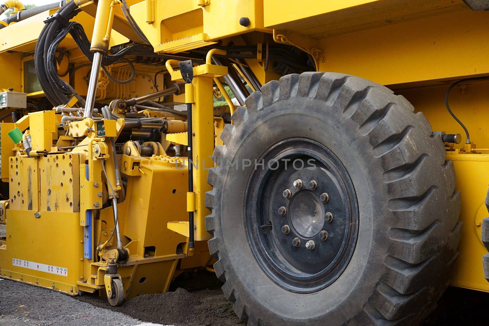 Road cold milling machine removes the old asphalt. Repaving the road surface. Road works