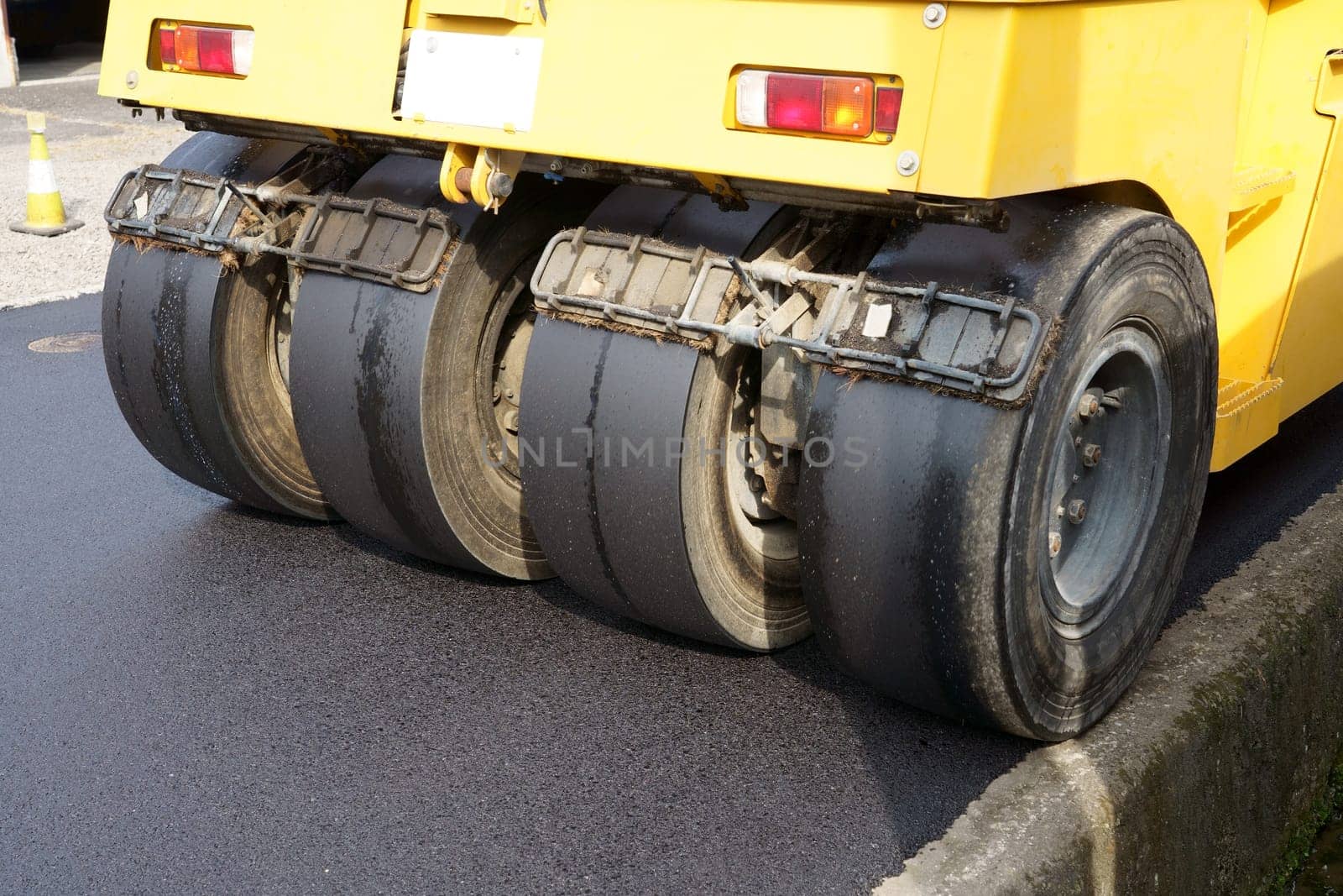 Heavy vibratory road roller close-up. Repaving the road surface. Road works