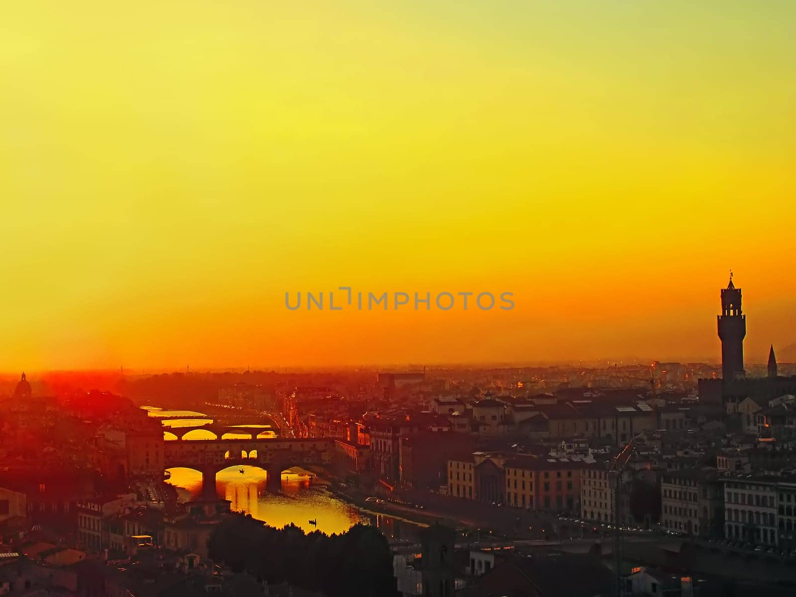 Sunset in Florence with Ponte Vecchio and River Arno , Italy