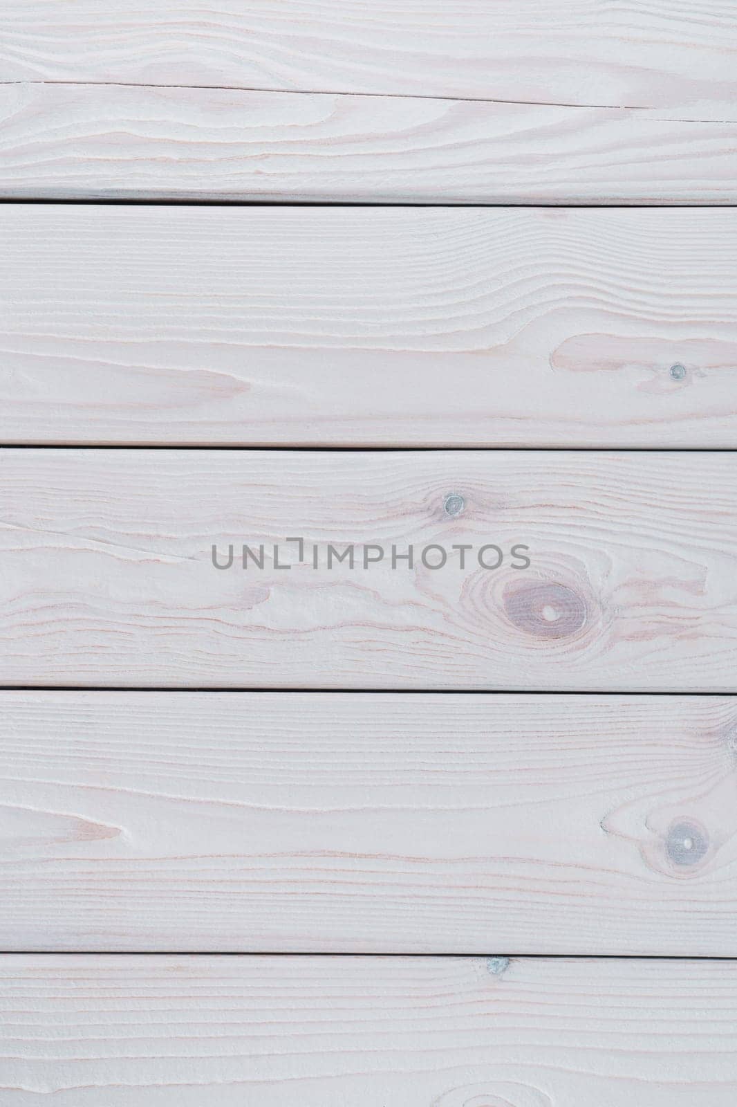 White striped planking. Wooden plank background for design and decoration. Copy space. Place for text. Light hardwood material. Horisontal row of floorboards. Wooden textured, natural tree. Vertical