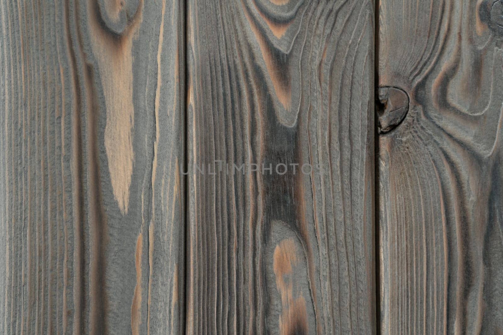 Gray striped planking. Wooden plank wall background for design and decoration. Empty space. Place for text. Dark hardwood material. Vertical floorboards. Wooden textured, natural tree.