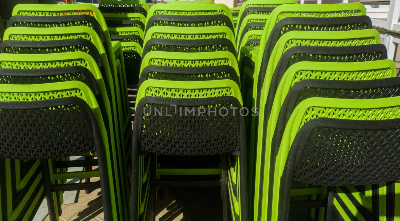 Pilled terrace plastic stools. Black and green color