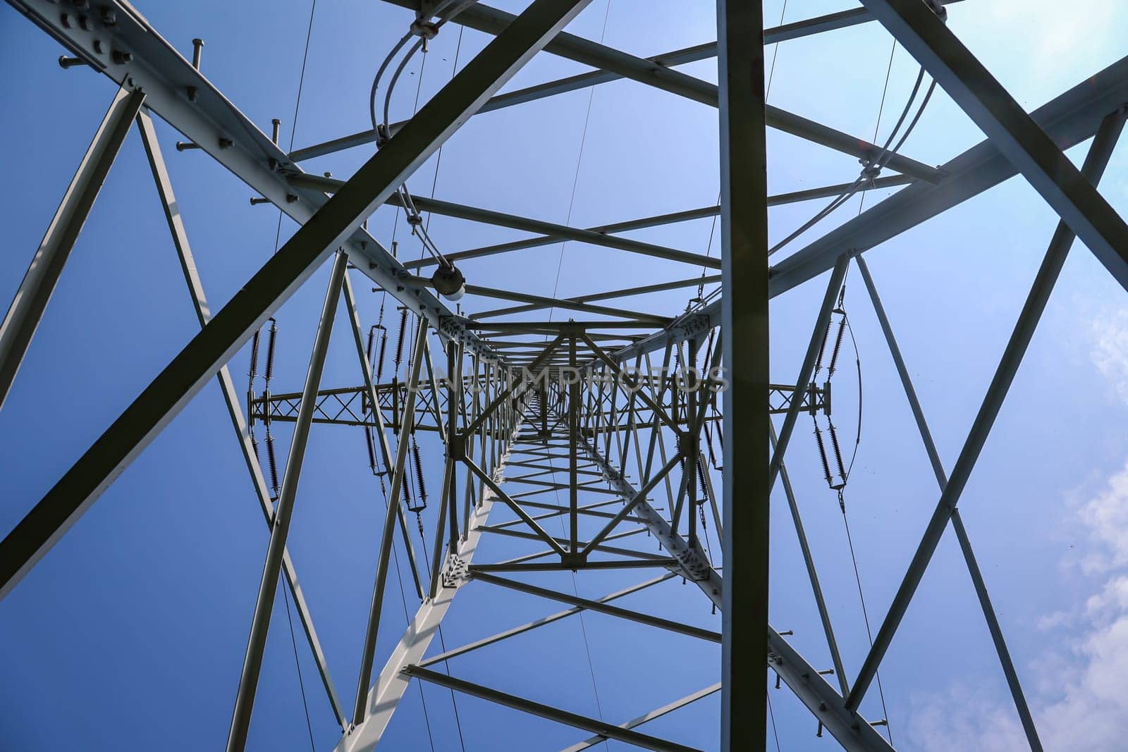 The steel pole from a power pole. Power lines are held by a metal pole.