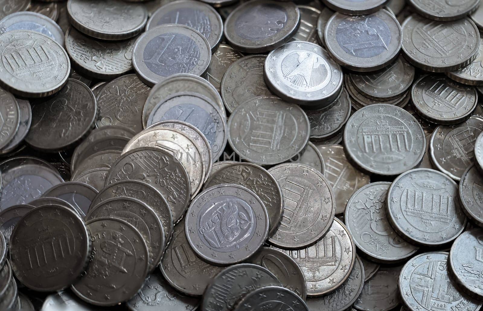 Many coins, euro currency lying in a heap.