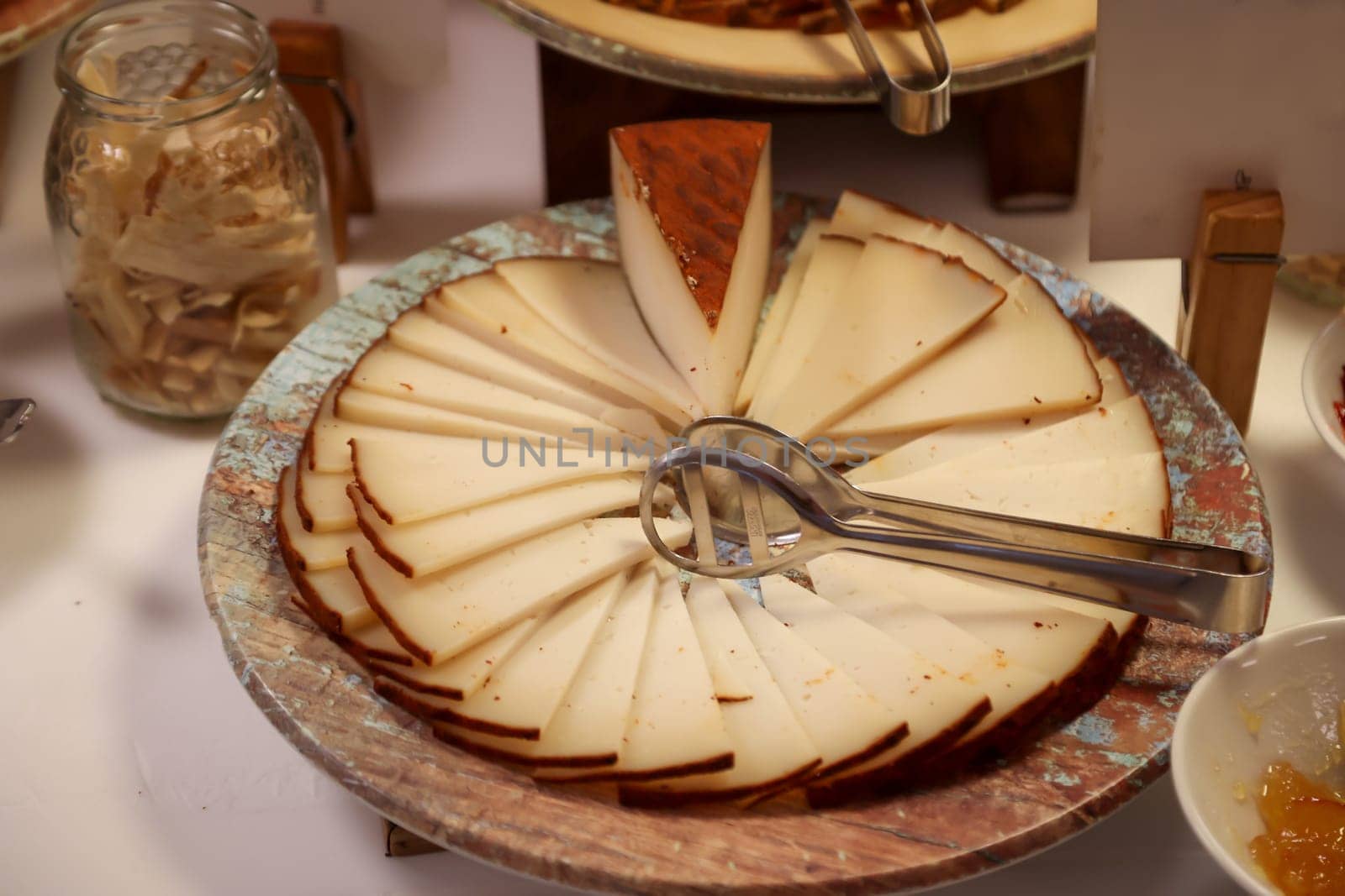 Many slices of cheese cut in the shape of a cake.