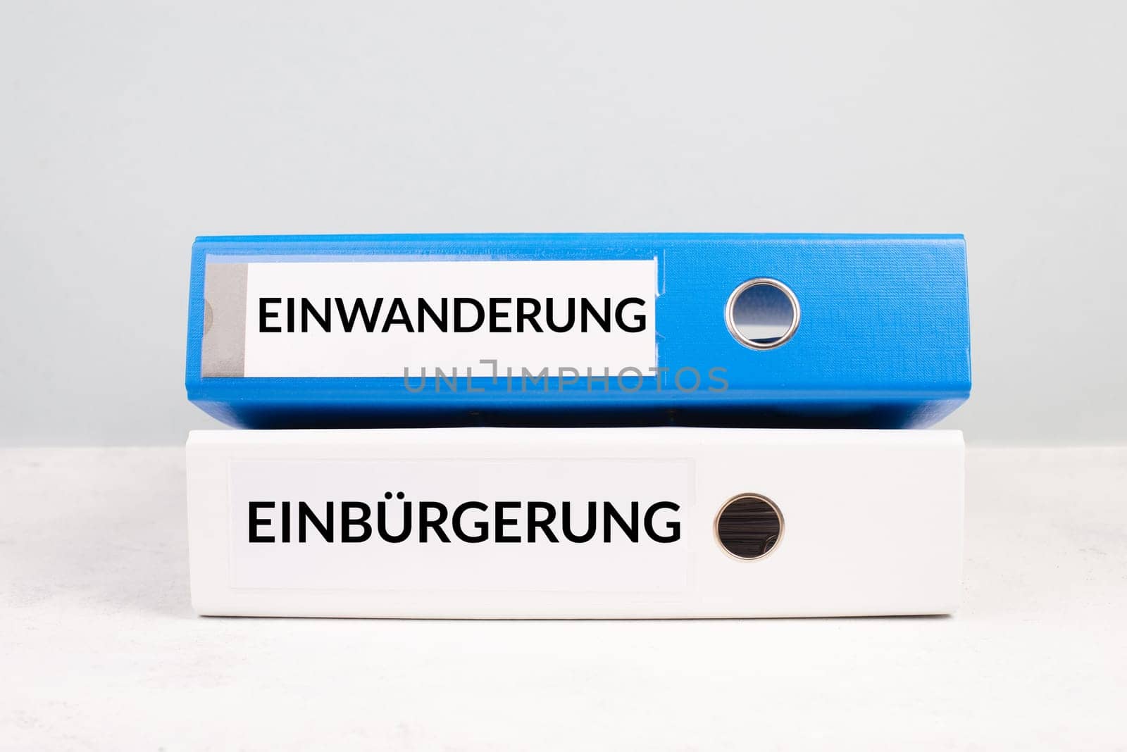 Naturalization and immigration is standing in german language on the folders, new reform immigrants and asylum seekers to receive citizenship