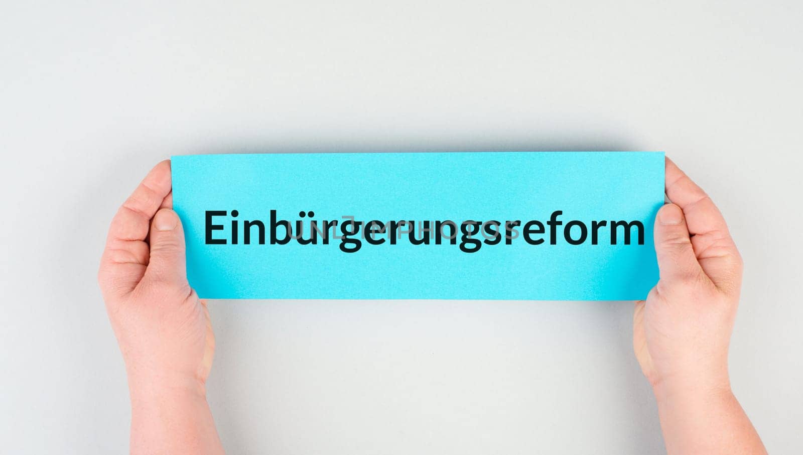 Naturalization reform is standing in german language on the paper, new law in Germany for immigrants and asylum seekers to receive citizenship