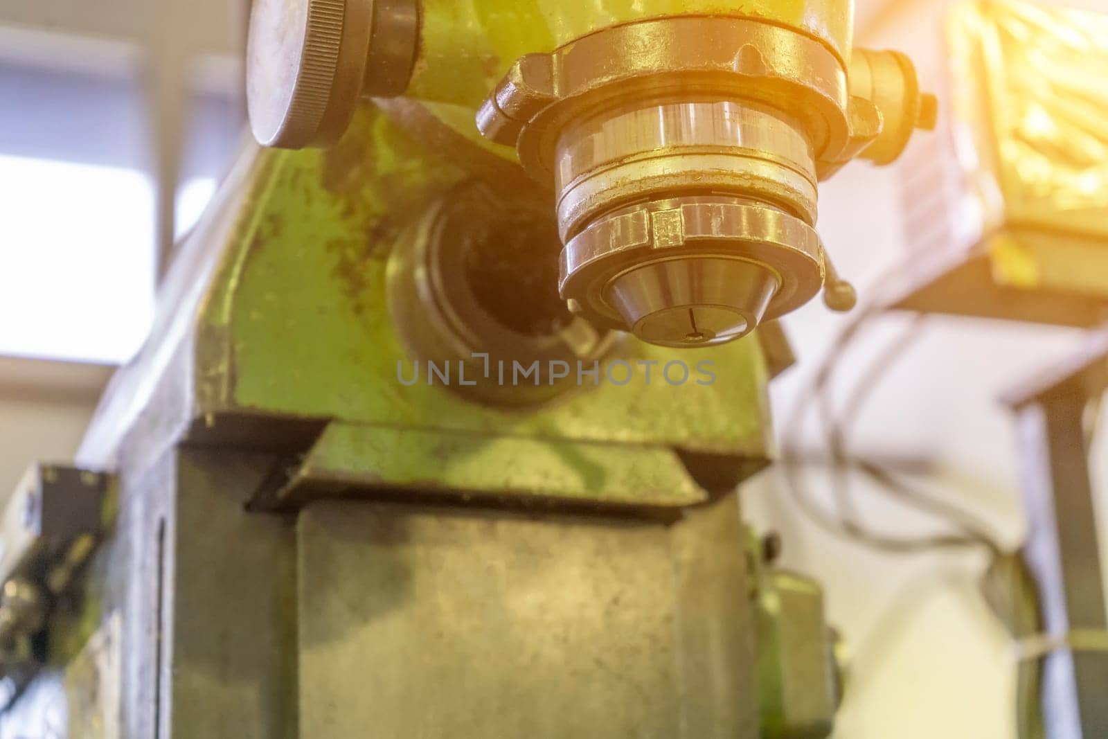 Machine workshop with drilling machine in morning