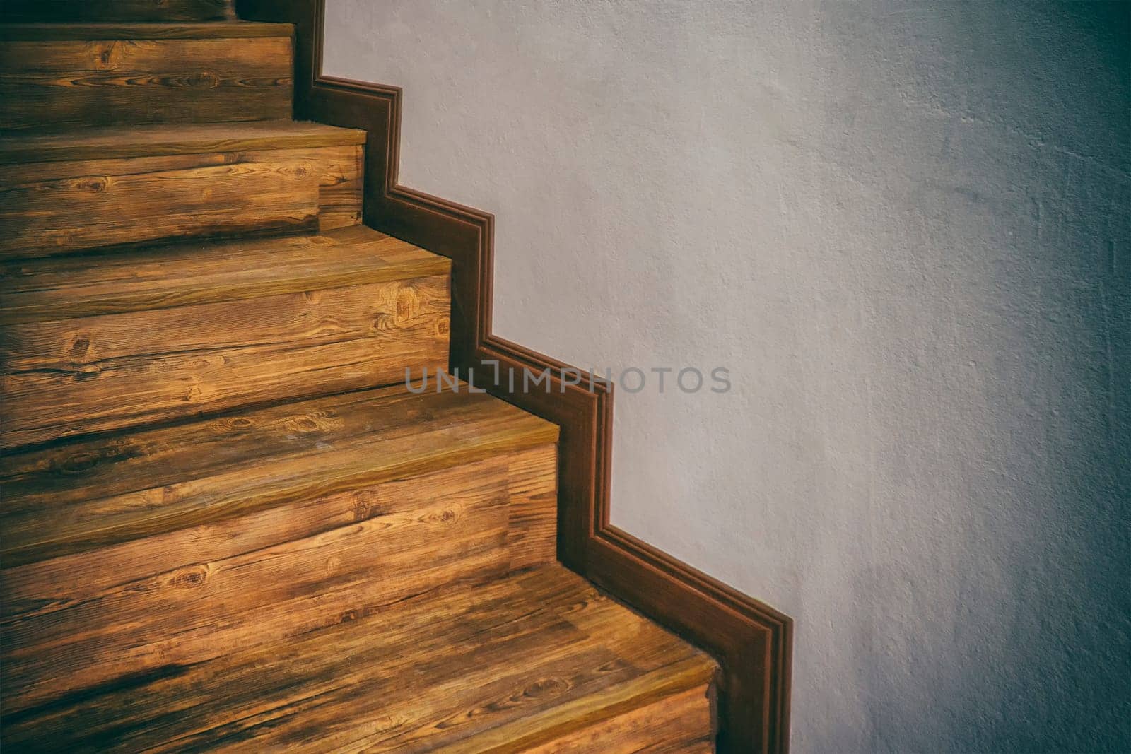 Wooden stairs climb up hardwood inside home