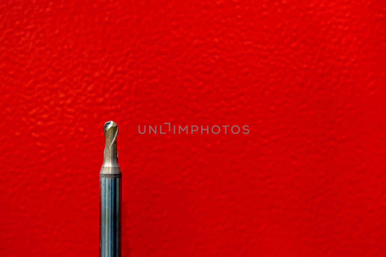 CNC tool ball or endmill ball dilapidated and red background