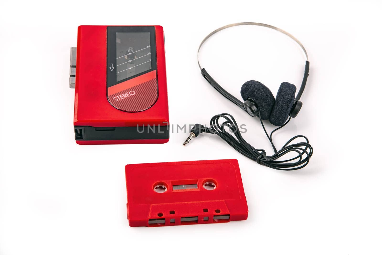 Red Walkman with Headphone and Tape isolated on bright background